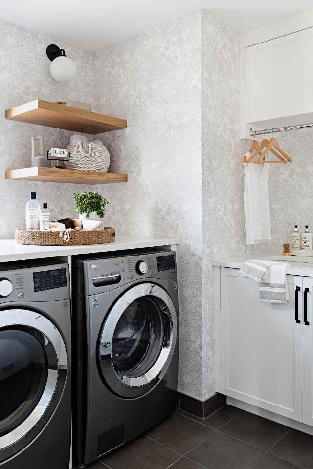 designer laundry mudroom with all natural look of wood shelving and wallpaper